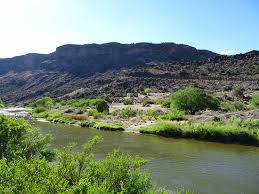 A river flowing through a rocky, high-desert landscape in New Mexico